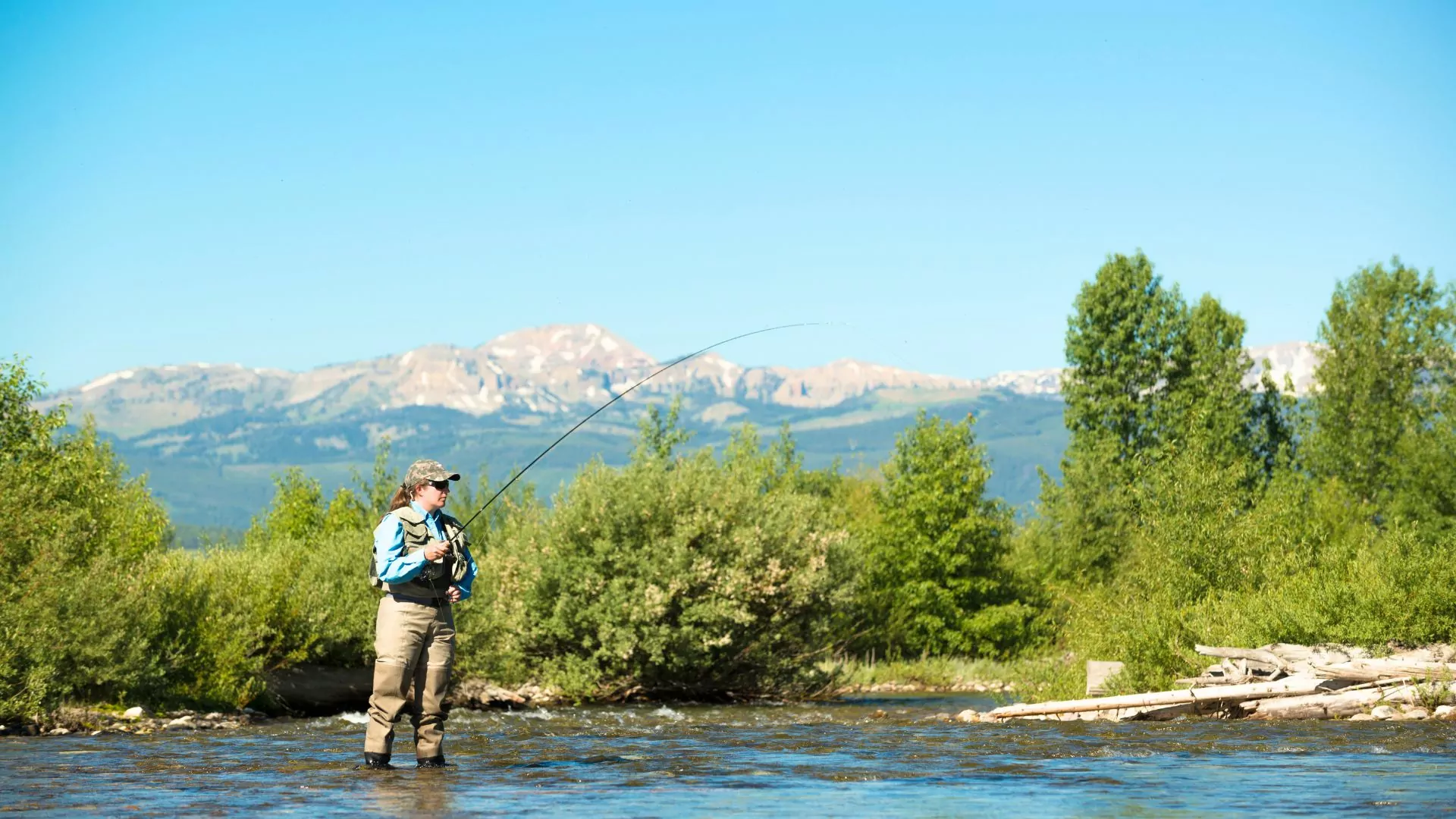A woman fly fishes in Montana