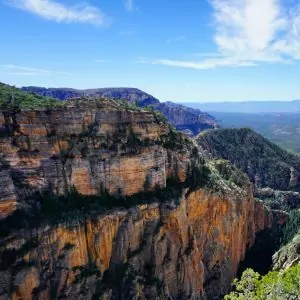 Sheer rock cliffs and blue skies are common in the desert of northern Arizona