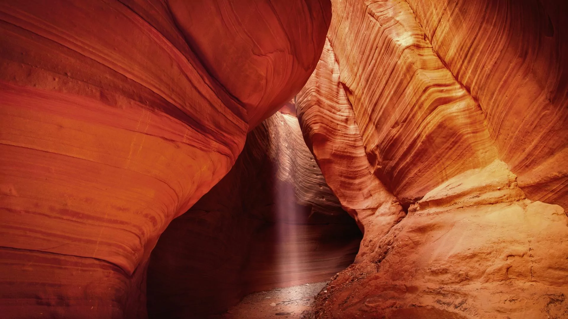 Sun shines down into peekaboo slot canyon in grand staircase escalante national monument